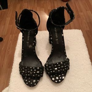 Women black and sliver star heels